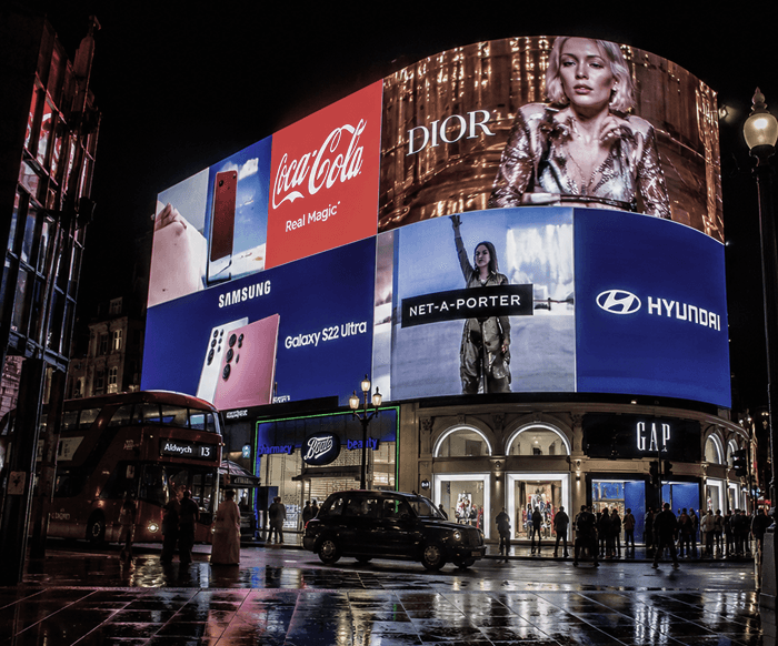 Out-of-home billboards lighting up Piccadilly Circus at night