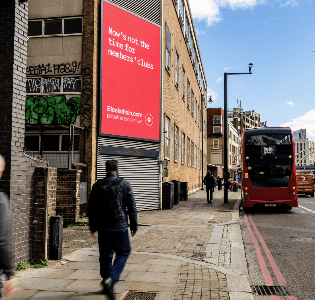 Blockchain.com ‘Now’s not the time for members’ clubs’ billboard on a London street