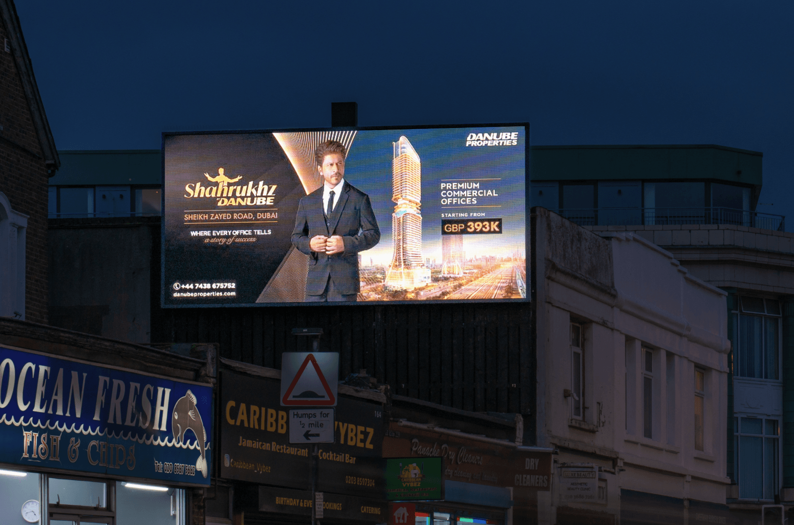 Danube Properties billboard above Ocean Fresh at dusk