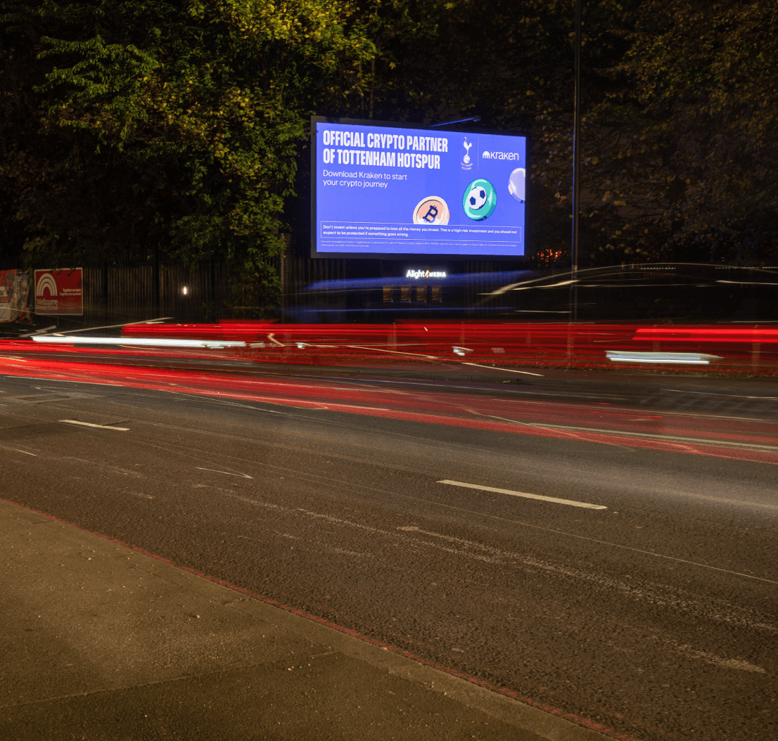 Kraken ‘Official Crypto Partner Of Tottenham Hotspur’ billboard with traffic light trails