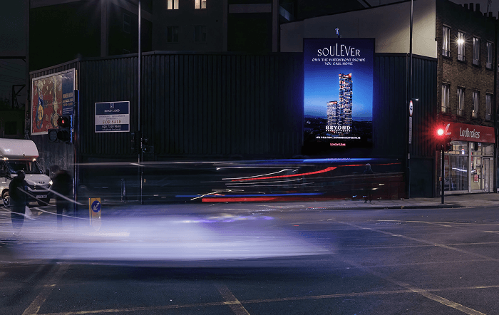 Soulever billboard by Beyond at a night junction