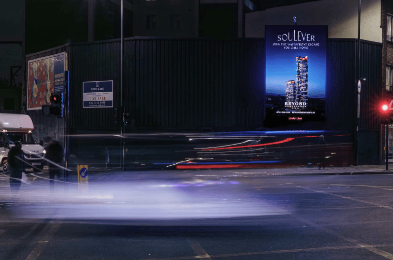 Soulever billboard by Beyond at a night junction