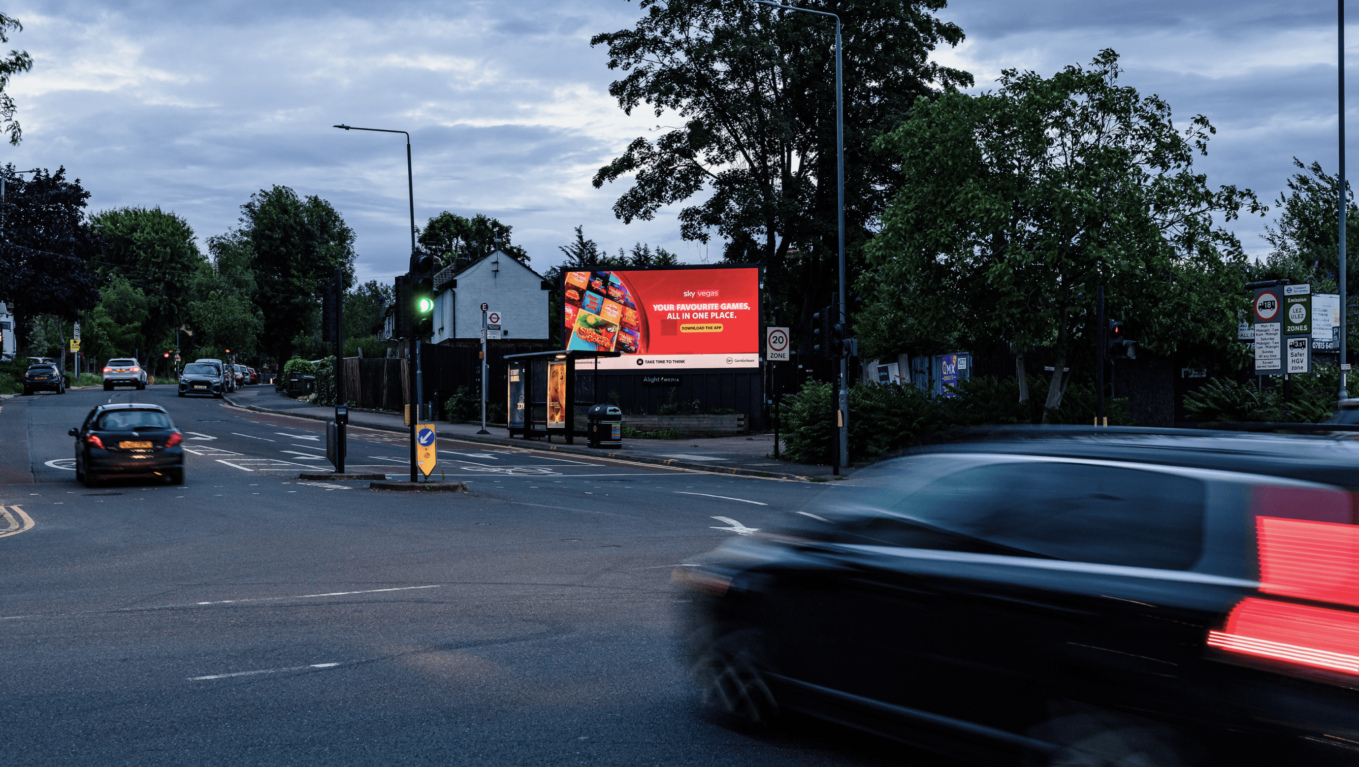 Sky Vegas ‘Your Favourite Games, All In One Place’ billboard on a dusk street