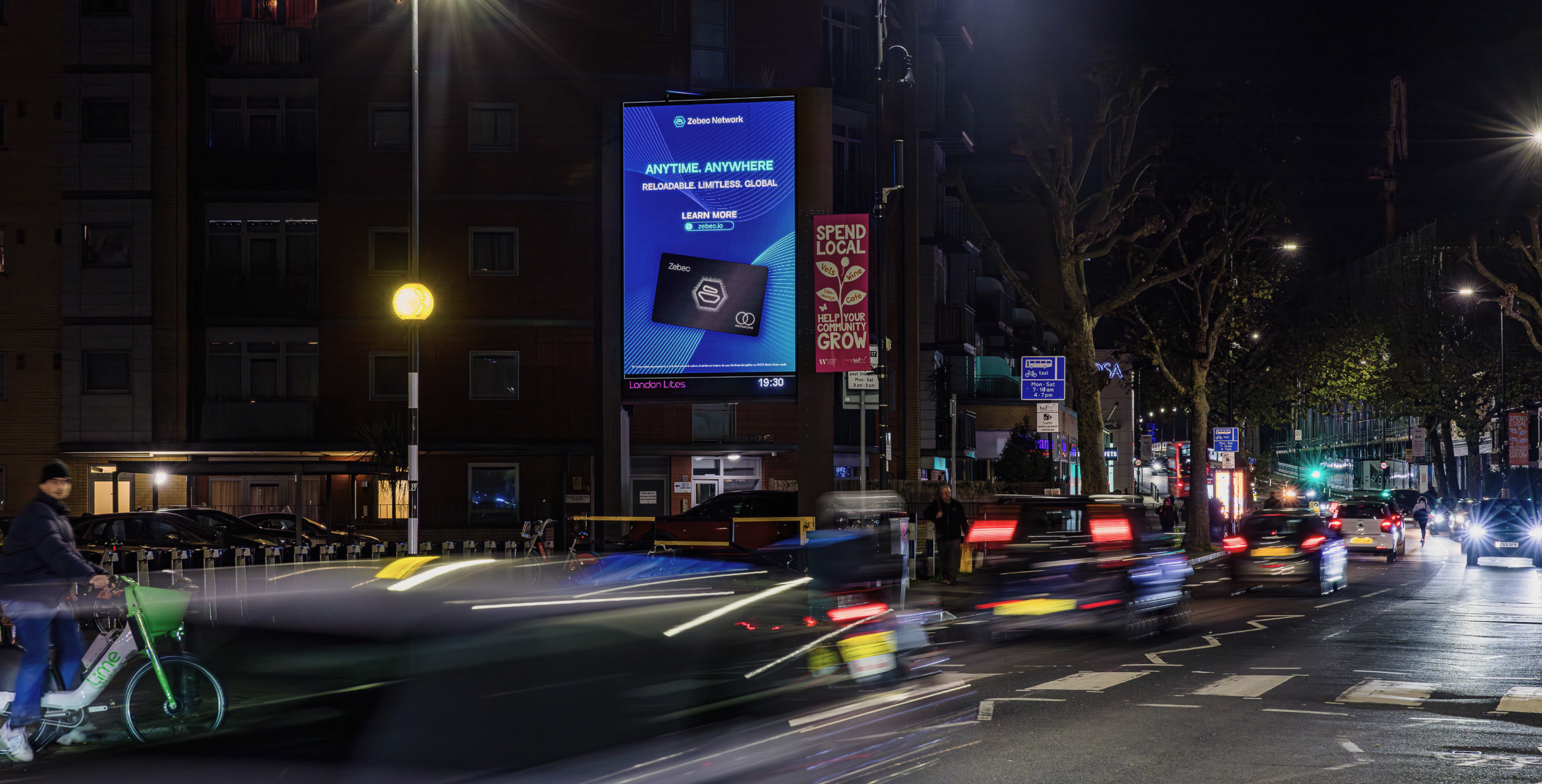 Zebec ‘Anytime. Anywhere’ billboard on a night street with traffic trails