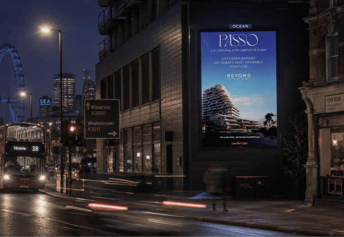 Beyond Developments PASSO out-of-home billboard on a London street at dusk